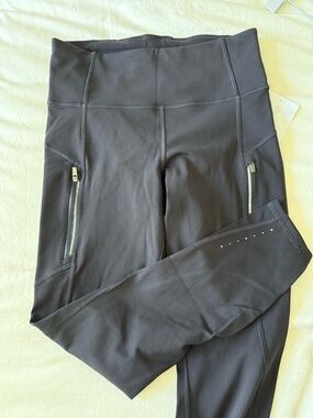 Athleta Black High-Rise Leggings with Zip Pockets